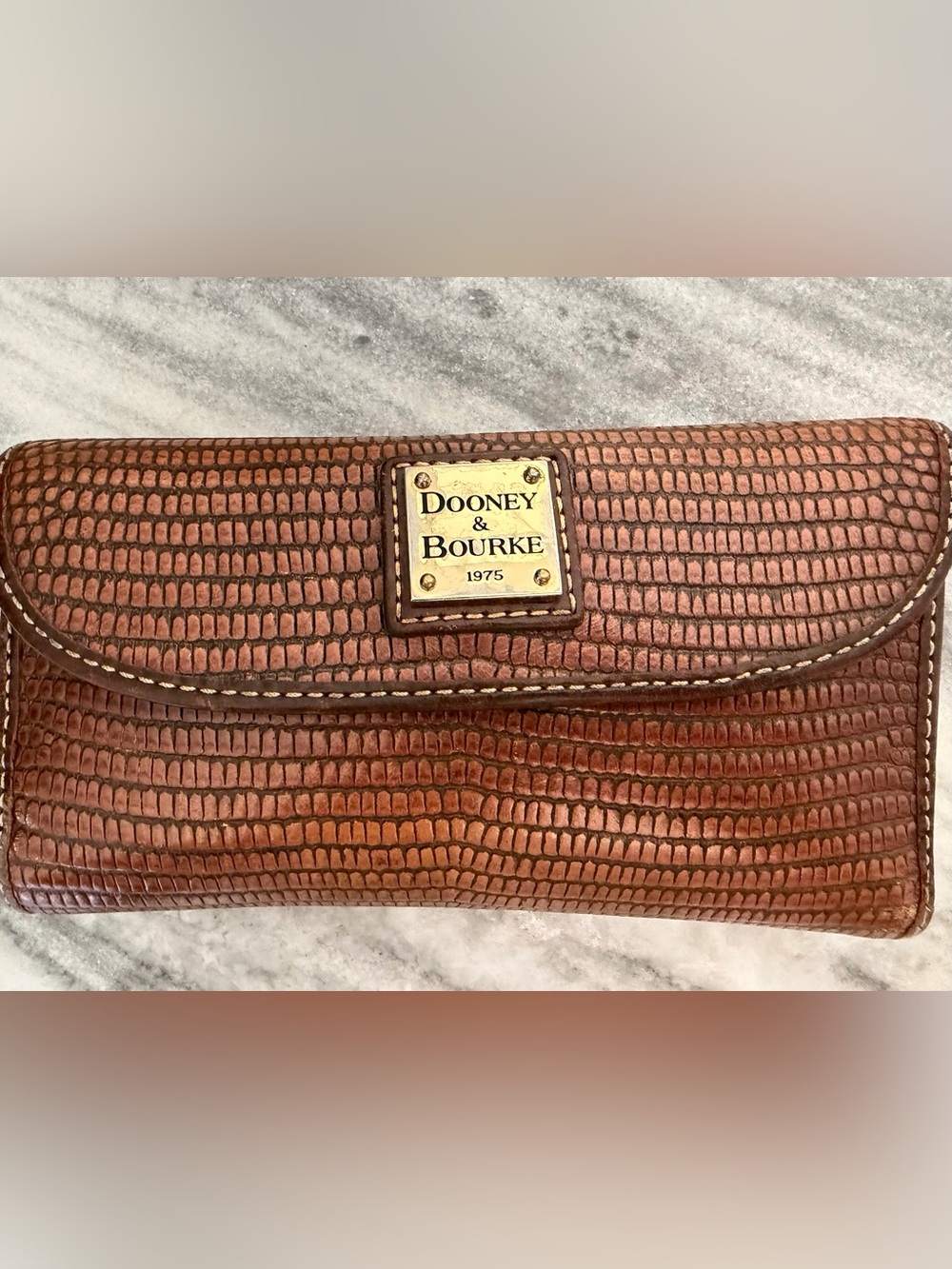 Dooney & Bourke Brown Embossed Leather Wallet with Brass Logo Plaque